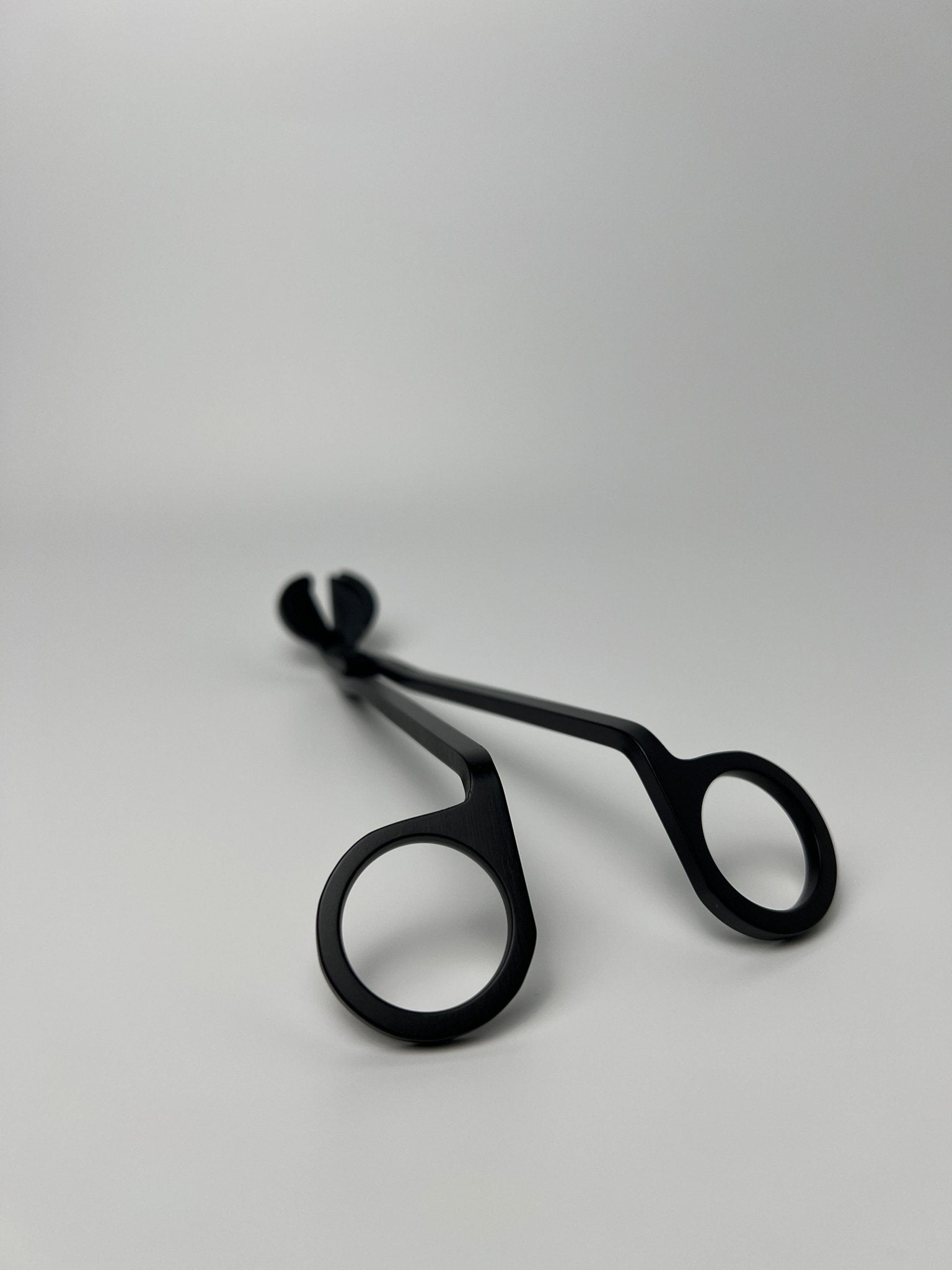 Introducing our elegant and practical candle wick trimmer, the perfect tool for any candle lover. With its precision blades and sleek design, it ensures a clean and even burn for a longer-lasting, more fragrant candle experience.