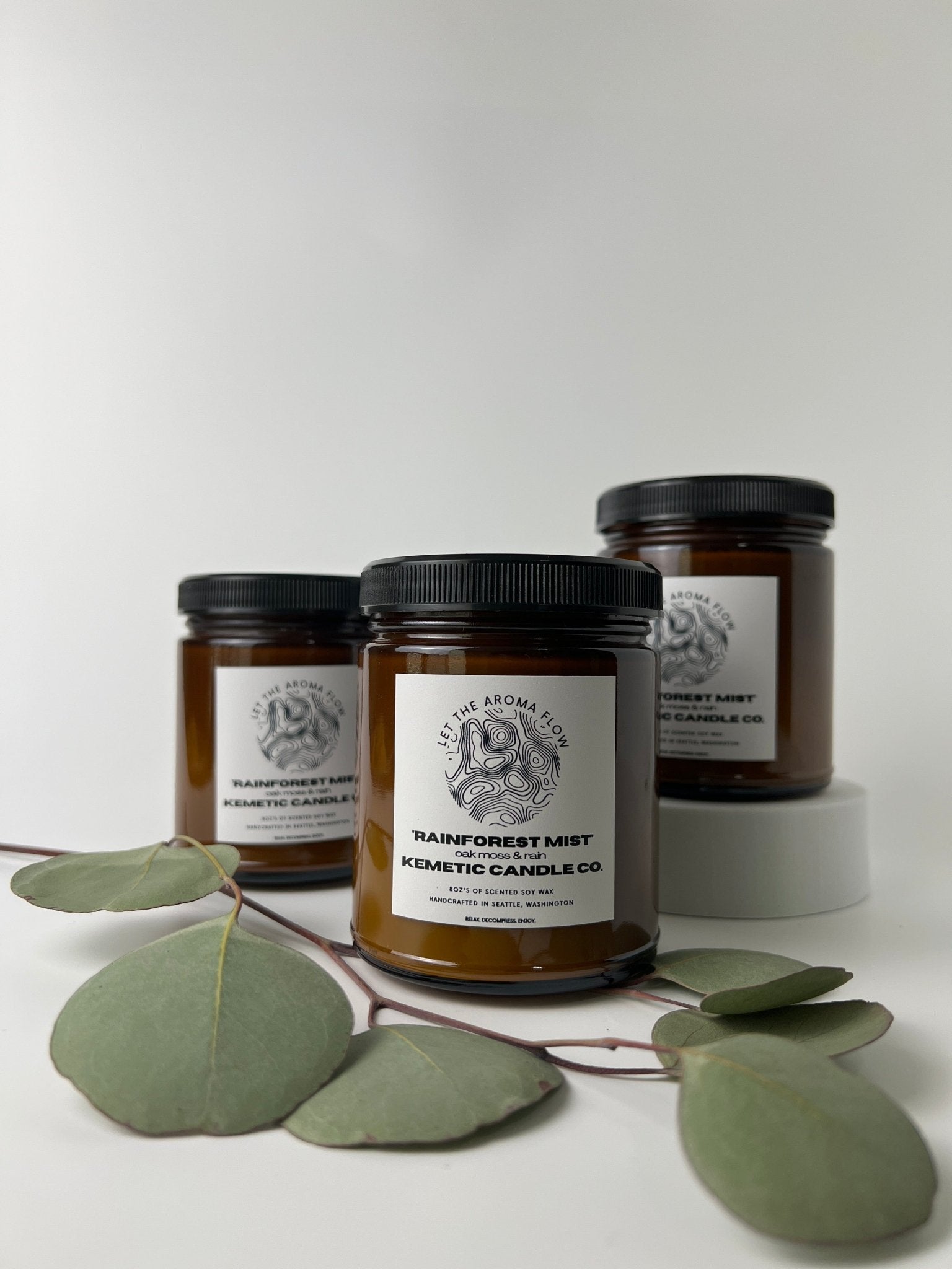 Bring the refreshing scent of the Pacific North West rainforest into your home with Kemetic Candle Co.'s Rainforest Mist 8 oz candles. Shop now and experience nature's tranquility.